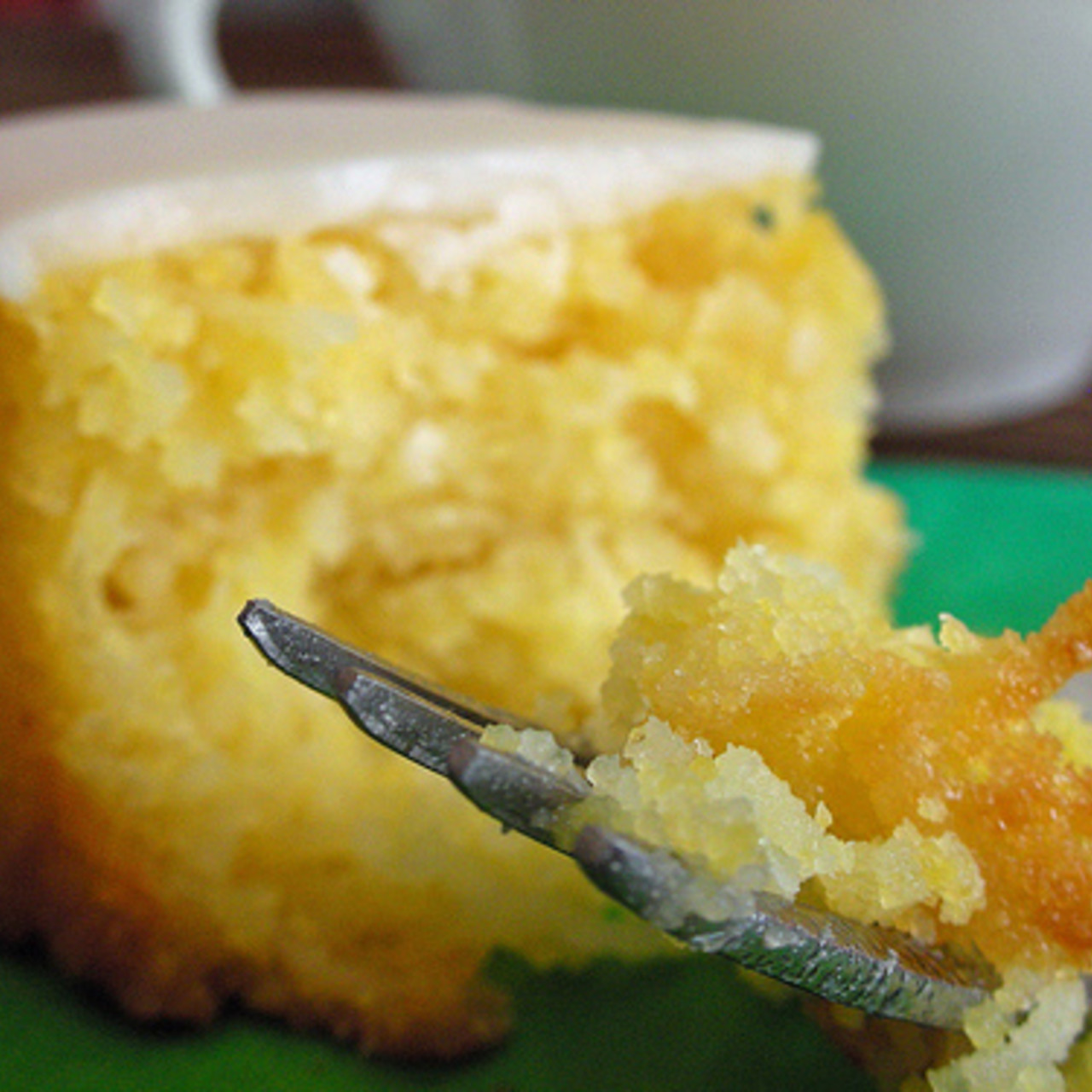 Picture showing a delicious slice of low FODMAP polenta cake. Great for IBS symptoms