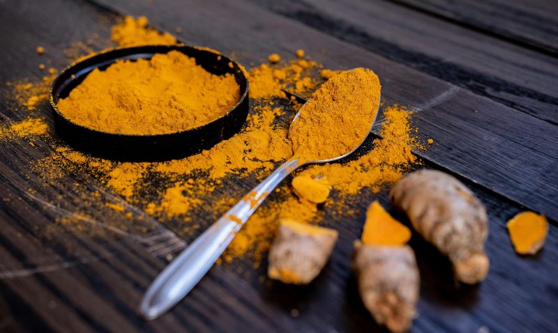 Curcumin - is it a cure for IBS. A spoon showing turmeric
