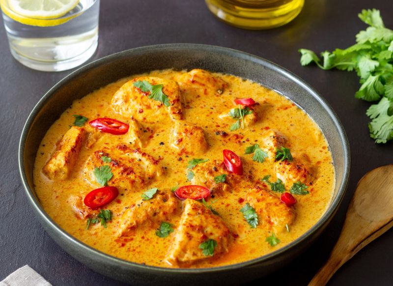 A grey dish showing a delicious low FODMAP coconut & lime fish soup
