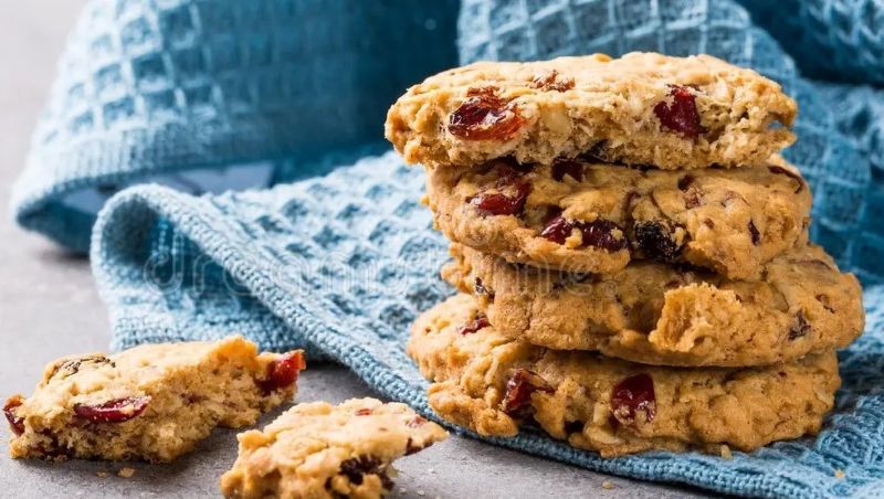 Low FODMAP Oat Cookies with cranberries on blue tea towel