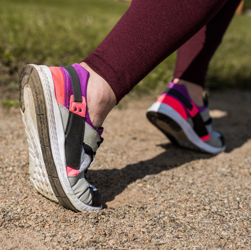 An image showing a person wearing trainers, running to depict IBS symptoms and exercise
