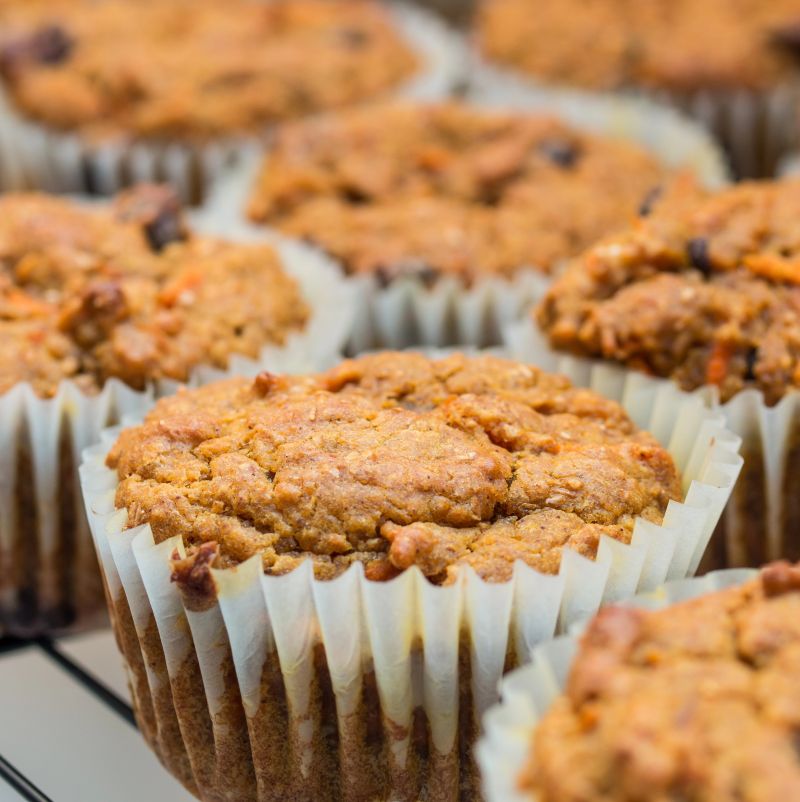 An image showing freshly baked Low FODMAP Banana and Carrot Muffins